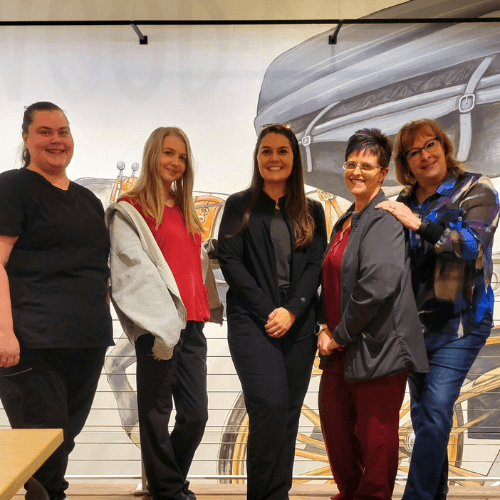 vet staff doing laser therapy of a dog